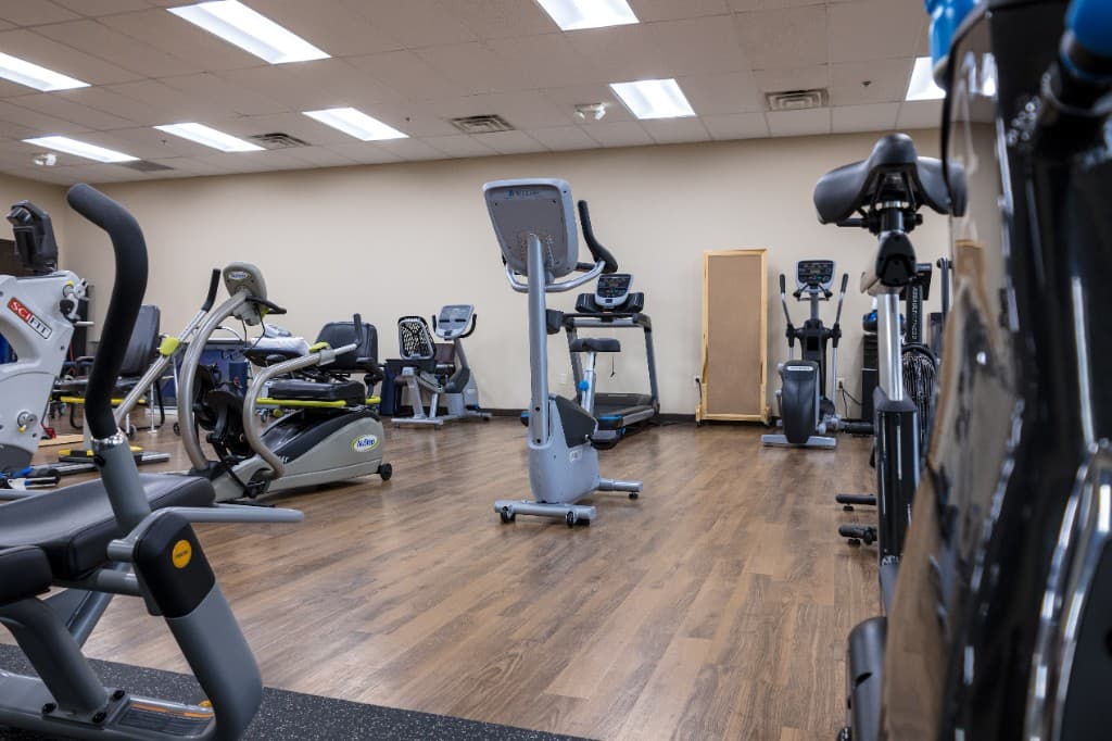 Cardio and conditioning equipment in the Excel PM&R therapy gym