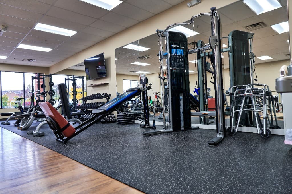 Strength-training machines and free weights in the Excel PM&R therapy gym